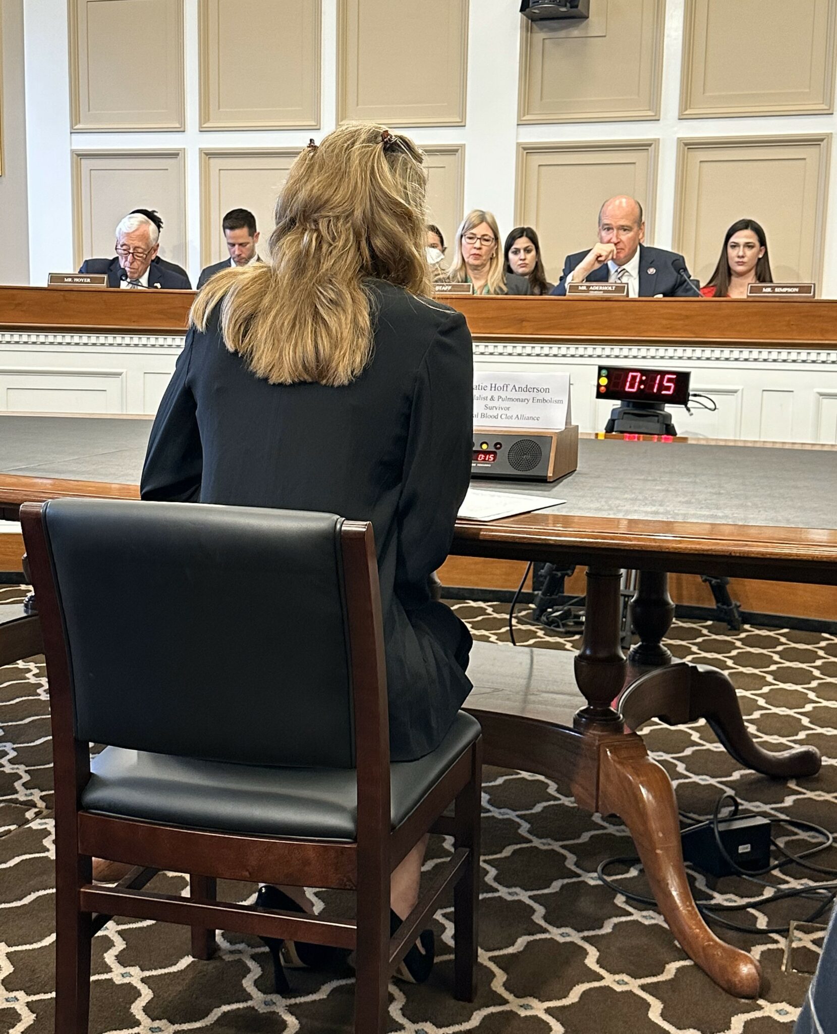 Katie Hoff sitting at a table before the before the U.S. House of Representatives Labor-HHS Appropriations Subcommittee about the critical need for blood clot awareness and education funding.