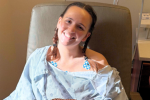 Sara Donnelly, a pulmonary embolism and DVT survivor diagnosed with four blood clots in her lungs hours before her 27th birthday following cardiac ablation surgery.