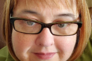 Tammie Pruett, a saddle pulmonary embolism survivor diagnosed in October 2020 after atypical symptoms — feeling unwell, breathing difficulty, and unexpected sweating — with no chest pain present.